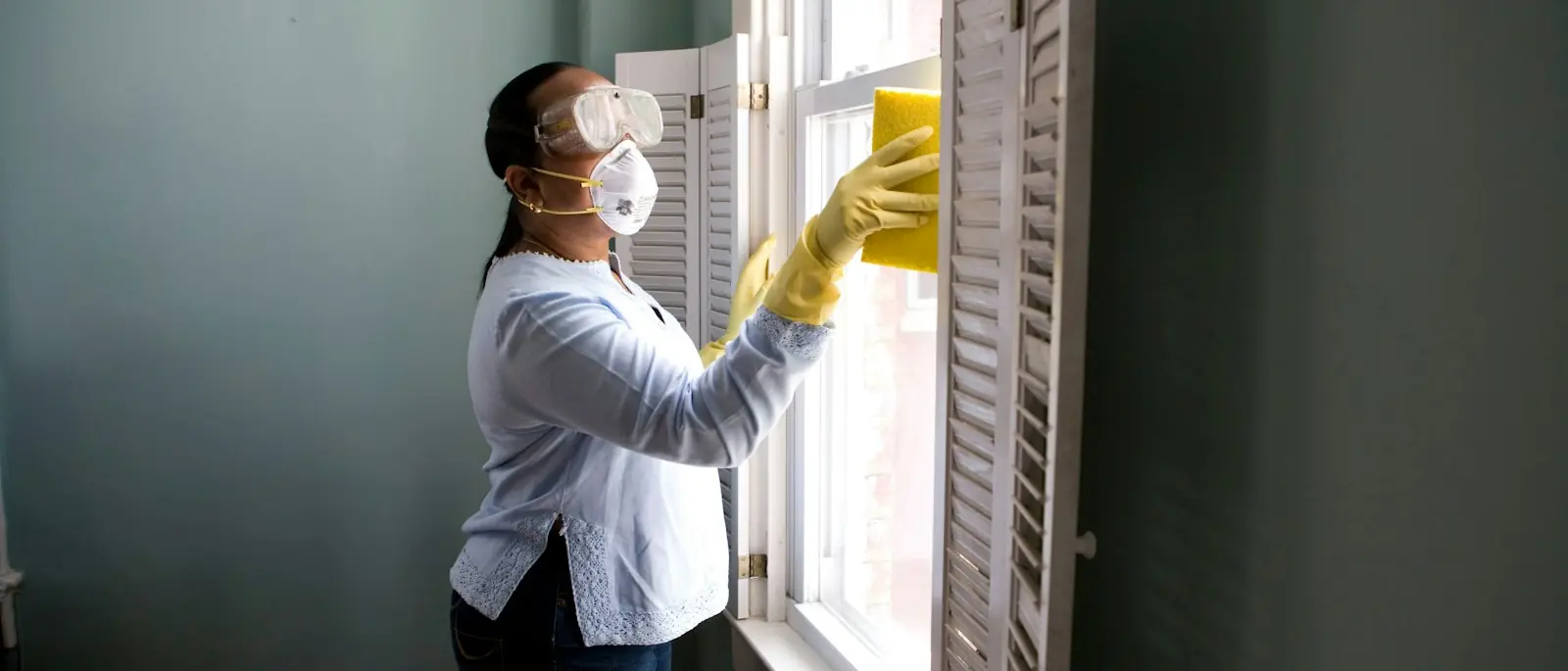 Sharp Painting professional applying a fresh coat